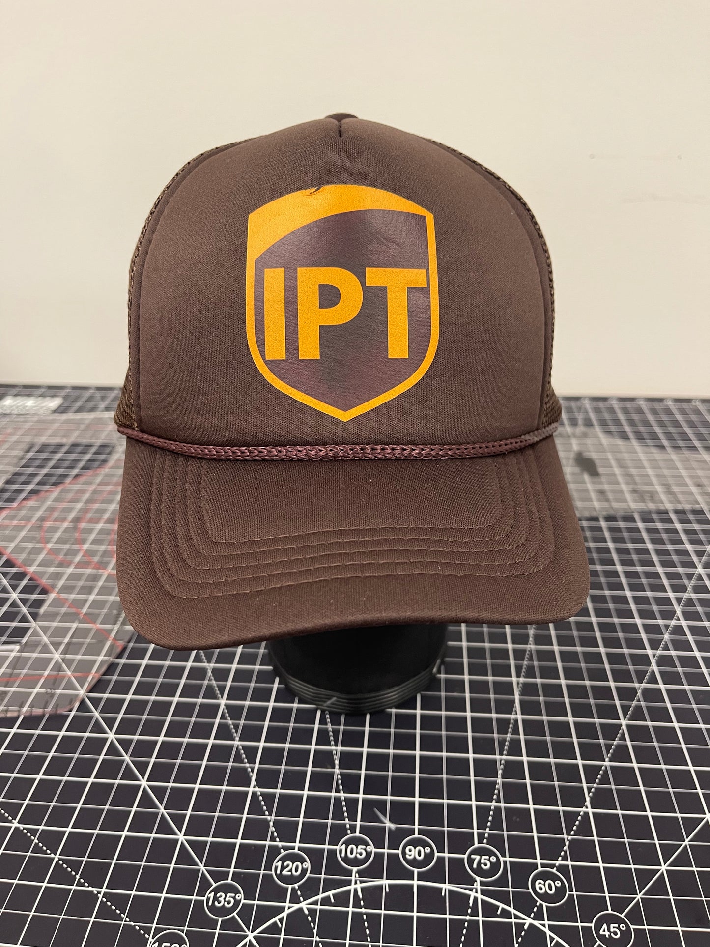 IPT Shield Trucker Hat – Brown Edition
