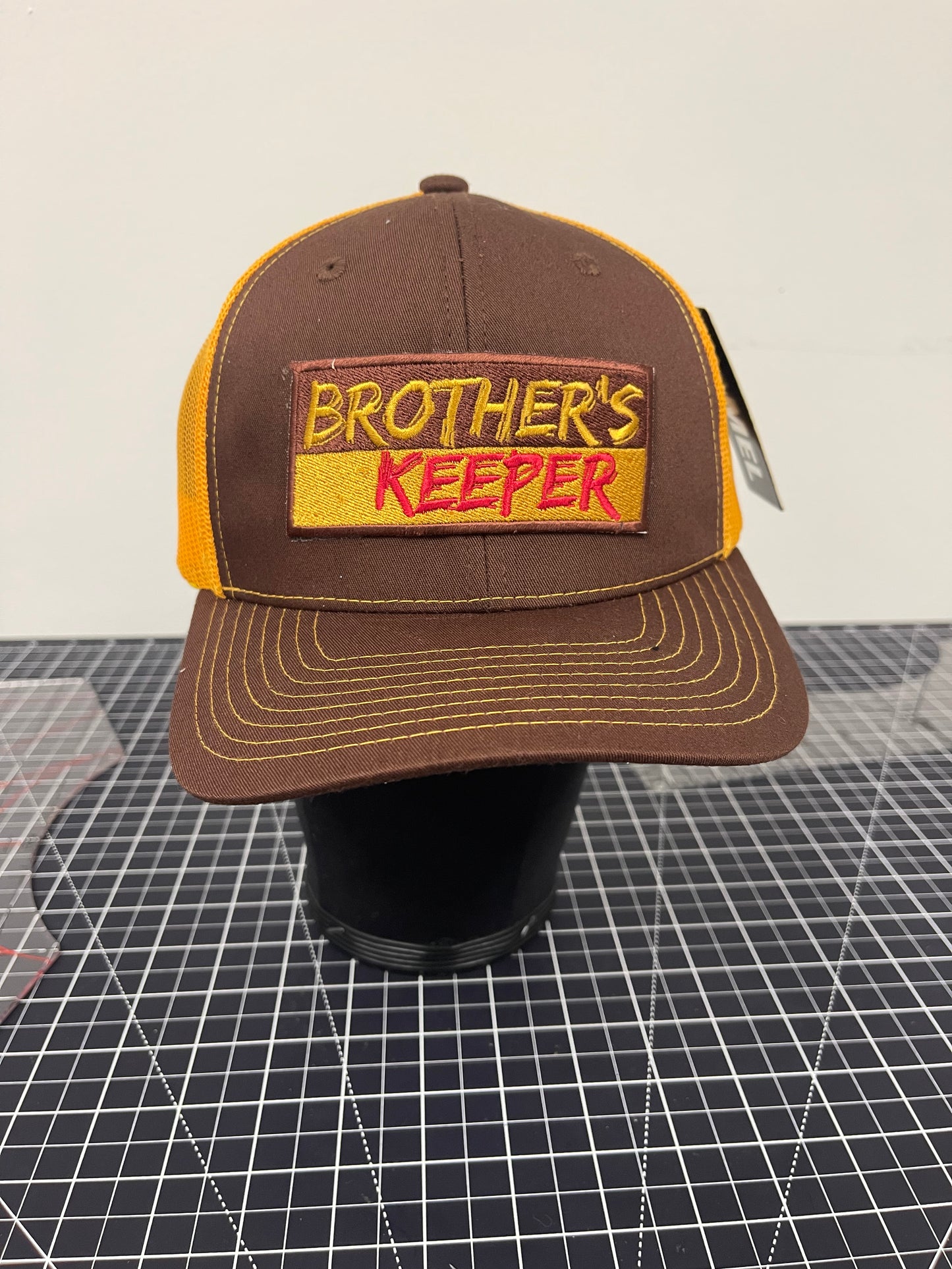 Brother’s Keeper Trucker Hat – Brown/Gold/Red Edition