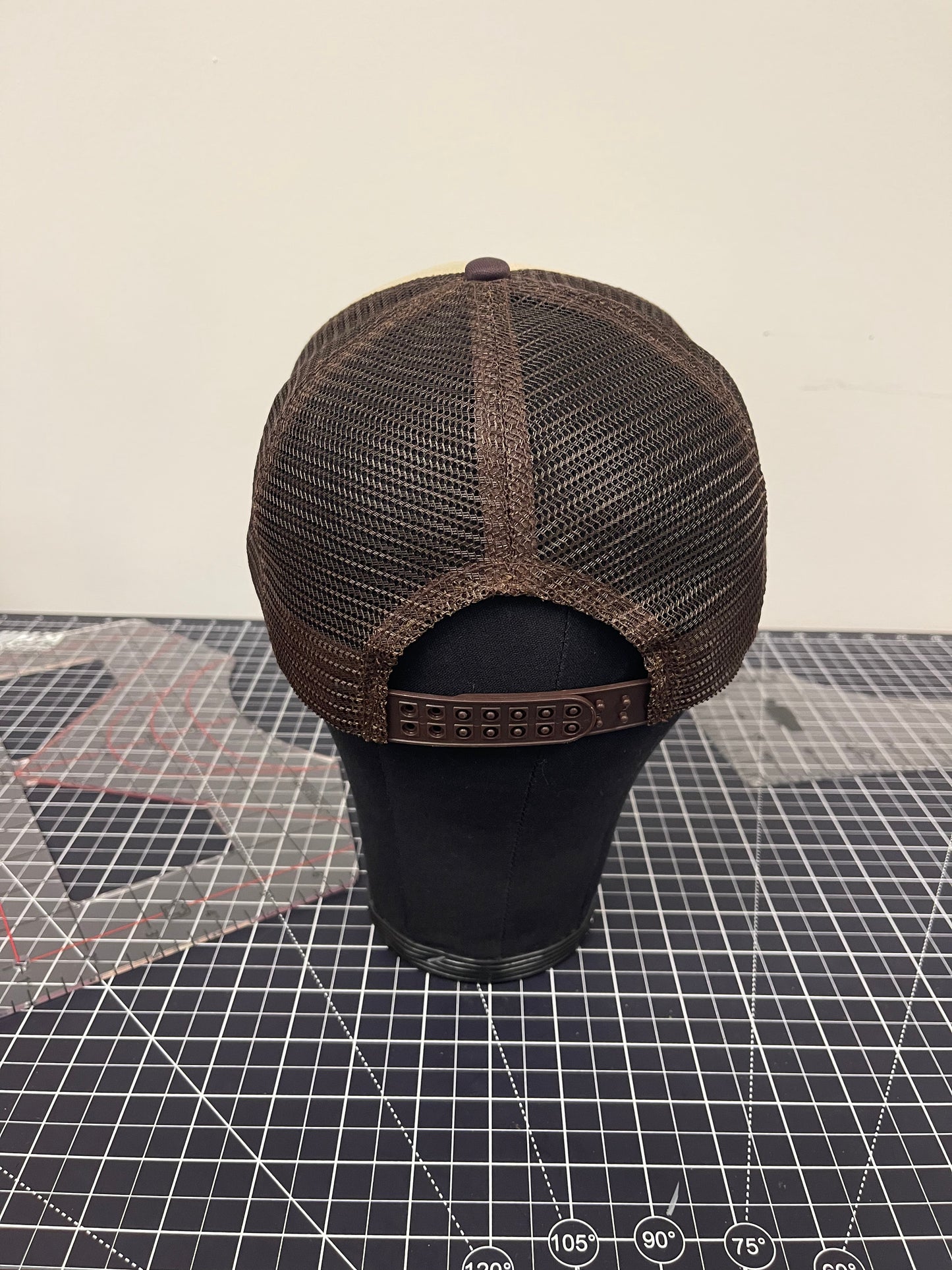Iota Shield Emblem Trucker Hat – Tan/Brown Edition